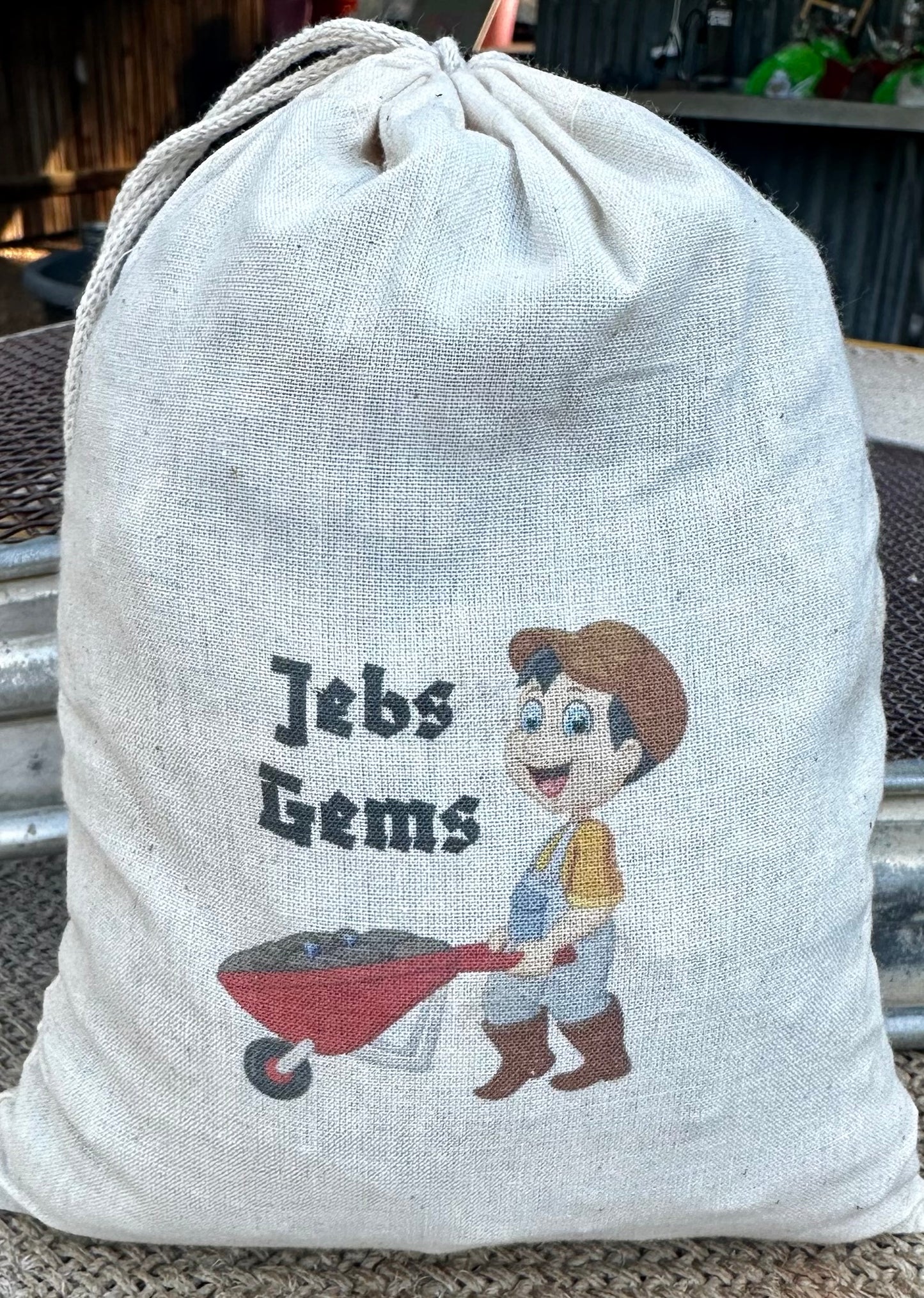 Large Loaded Jebs Gems Wash Bag, includes a small cut Sapphire